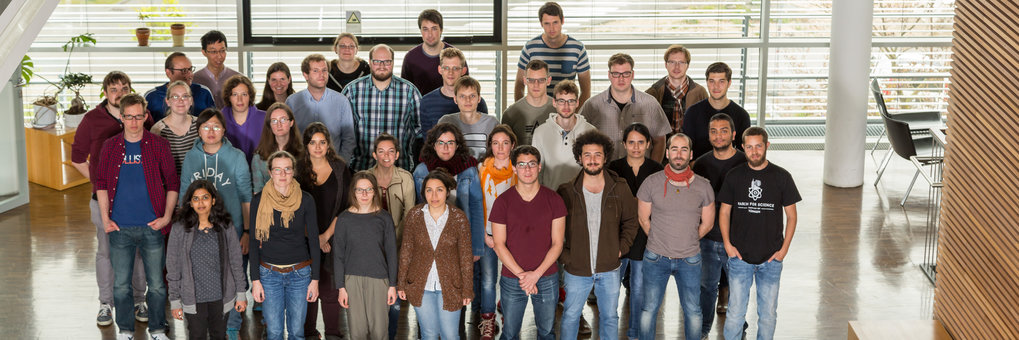 Group photo of 35 PhD students inside the institute.