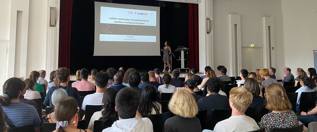 View into a full lecture hall during a talk